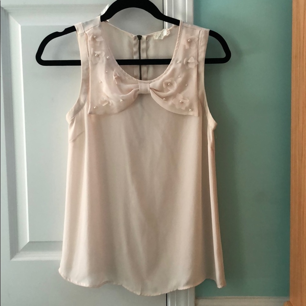 Off-white blouse with pearls and bow